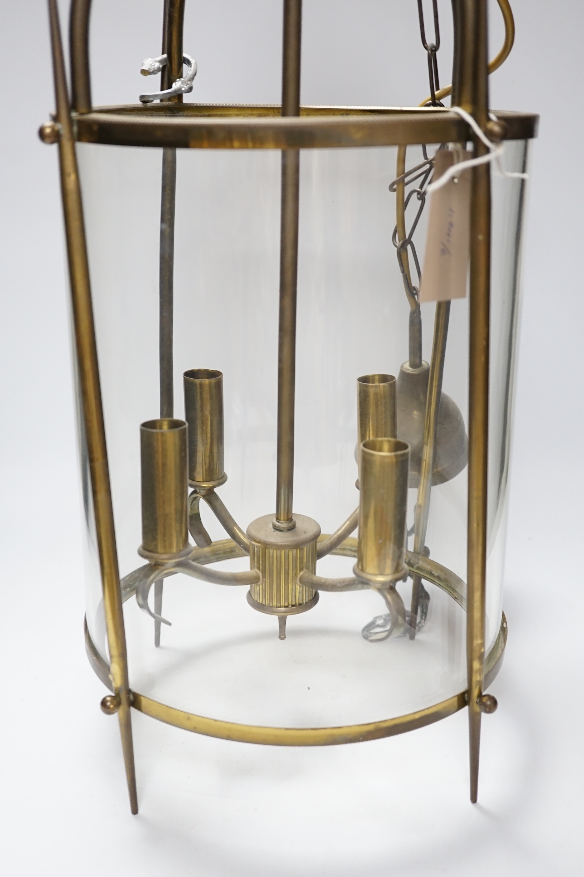 A circular brass and glass four light lantern 59cm high